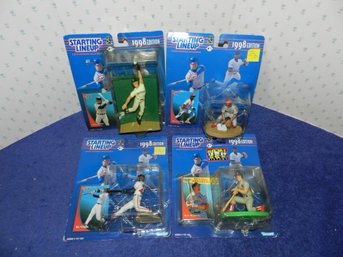LOT OF 4 STARTING LINEUP FIGURES LARKIN MCGWIRE WALKER VAUGHN