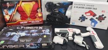 Mixed Kids Toy Lot: 3 Boxes Of Play Sets & Toys - Laser Tag Sets & Shazam Armor