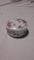 Small Covered Container With Flowers Has Name On The Bottom