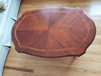 Brown Wooden Coffee Table With Carved Legs And Details