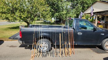 Collection Of Fishing Poles And Reels
