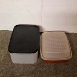 Two Tupperware Containers With Lids