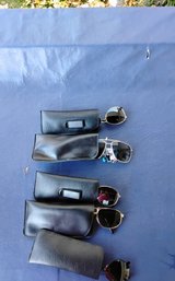5 Pair Of Never Used Sunglasses With Cases
