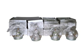 Four Illuminating Glass Ornaments With Boxes