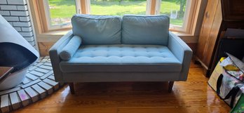 Mid-century Modern Style Loveseat Sofa Upholstered In Light Blue Fabric.