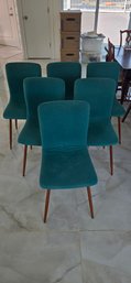 Set Of Five Teal Upholstered Dining Chairs With Wooden Legs.
