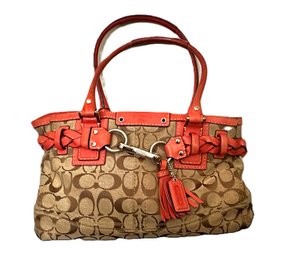 Signature Coach Cloth And Burnt Orange Leather Handbag