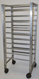 Vintage Industrial/ Bakers Rack On Wheels