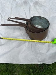 Set Of Three Vintage Copper Saucepans With Iron Handles.