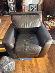 Worn Black Leather Armchair With Cushion.