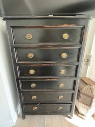 Tall Black Wooden Chest Of Drawers With Brass Handles And Decorative Trim.