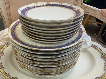 Stacked Vintage Limoges Porcelain Or Fine Dinnerware Set Featuring A Wide Cobalt Blue Border And Ornate