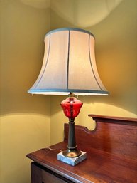 Victorian Style Table Lamp Featuring A Cranberry Glass Body, Brass Colored Column And Marble Base