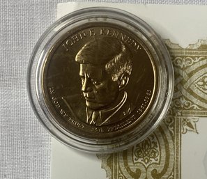 2015 John F. Kennedy Presidential Golden Dollar Collector-Grade Uncirculated Dollar.