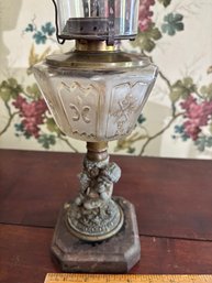 Oil Lamp With A Cherub Figural Base