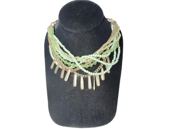 Lulti-strand Green Beaded Necklace With Gold Tone Accents And Dangling Charms