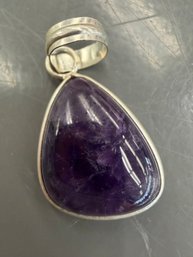 Purple Amethyst  Stone Pendant Set In A Sterling Silver Bezel