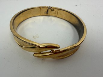 Vintage Gold-tone Bangle Bracelet Is A Monet Hinged Bypass Clamper Style Featuring A Textured Combed Design