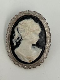Victorian Oval Brooch Featuring A White Cameo Portrait Against A Black Background In A Silver-tone Frame