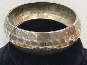 Hammered Brass Bangle Bracelet Featuring A Textured Design