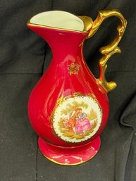 Limoges France Porcelain Pitcher Or Ewer Featuring A Burgundy/red Glaze