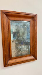 An Antique Framed Mirror