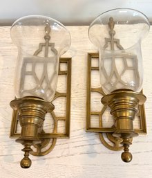 A Pair Of Brass Wall Sconces With Glass Hurricane Shade