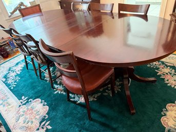 Classic Mahogany Dining Table And Matching Upholstered Chairs Feature A Rich Warm Wood Finish And Elegant
