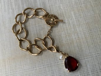 Retro Monet Gold Tone Toggle Bracelet With Clip On Red Faceted Charm