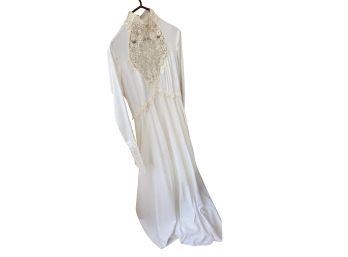 Vintage Edwardian Inspired Ivory High-neck Wedding Gown Features Intricate Lace Bodice Detailing And Delicate