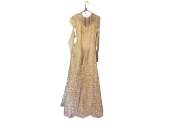Vintage Lace Wedding Gown Features An Off Th Shoulder Neckline And Long Sheer Sleeves With An Ivory Yellowed L