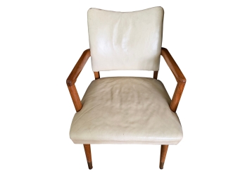 Vintage Mid Century Modern Wooden Armchair Featuring A Sculpted Wooden Frame And Off-shite Vinyl Upholstery