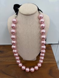 Erica Lyons Pink Faux Pearl Statement Necklace Featuring A Black Ribbon And Silver Accents