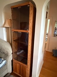 Pair Of Tall Oak Finished  Display And Storage Cabinets With Upper And Middle Glass Doors Alongside Lower