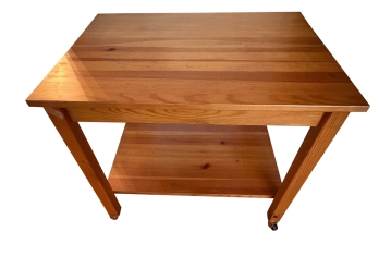 Light Oney Finished Solid Wood Rolling Kitchen Cart Features A Slatted Butcher Block Top And A Lower Storage