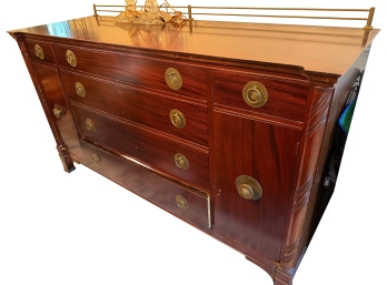 Flame Mahogany Sideboard Featuring Distinctive Brass Ring Pulls And A Warm Polished Wood Grain