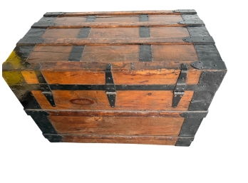 Late 19th Antique Wooden Flat Top Steamer Trunk Featuring A Pine Body With A Vibrant Wood Grain And