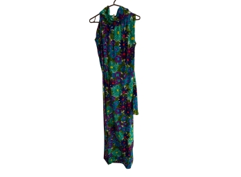 Vintage Sleeveless Maxci Dress Featuring A Vibrant Blue, Green And Purple Floral Pattern With A High Neckline