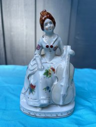 Vintage Porcelai. Victorian Woman Holding Cello Figurine