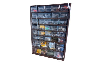 Multi Drawer Hardware And Craft Storage Cabinet Mounted On A Wall Displaying Clear Pull Out Compartments