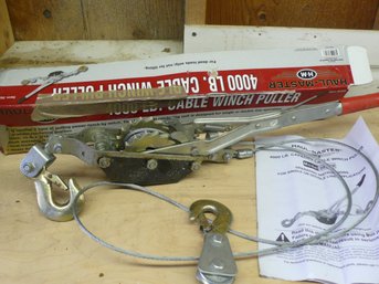 A Haul-Master 4000 Lb. Capacity Cable Winch Puller With 10 Feet Of Aircraft-Grade Steel Cable & Instructions