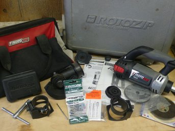 A RotoZip RZ10 Corded Spiral Saw Kit With A Carrying Case, Bits, Handles, Assorted Accessories, & Manual