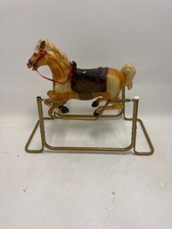 1970s Classic Children's Toys Feature A Molded Plastic Horse On A Metal Frame With Spring Action For Bouncing