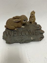 Rabbit Welcome Sign Statue' Or 'Bunny On The Rock Outdoor Sculpture Garden Animal Statue'.