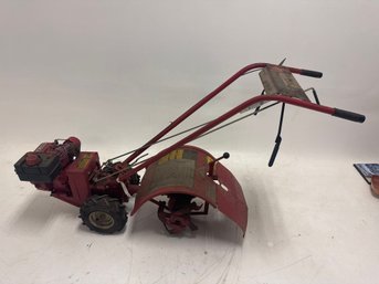 The Image Shows A Troy-Bilt Pony Rear Tine Tiller.