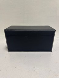 Black Faux Leather Storage Box With White Contrast Stitching.