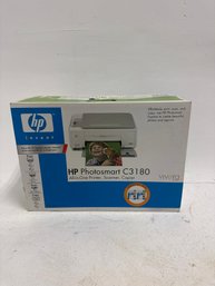 A New, Sealed HP Photosmart C3180 All-in-One Inkjet Printer.