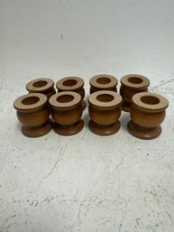 Set Of Eight Wooden Taper Candle Holders.
