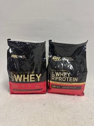 Two Optimum Nutrition Gold Standard 100% Whey Protein Powder In The Double Rich Chocolate Flavor.
