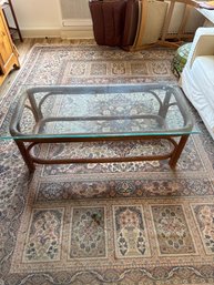 A Rectangular Rattan And Glass Coffee Table.